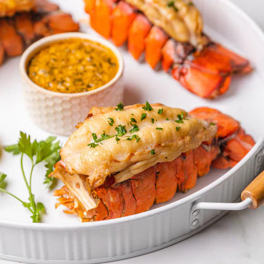 Broiled Maine lobster tails with golden crust and tender meat, served for a homemade gourmet seafood dinner.