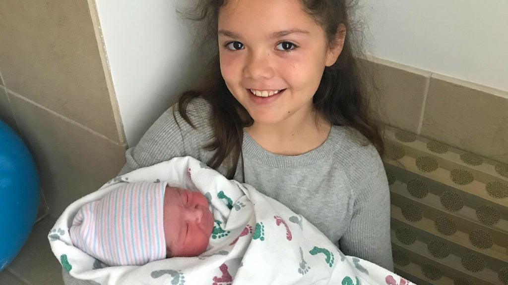 Newborn Scarlett Desgrosseilliers pictured with her big sister