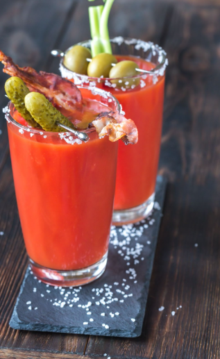 Two cocktail glasses filled with Lobster bloody mary.