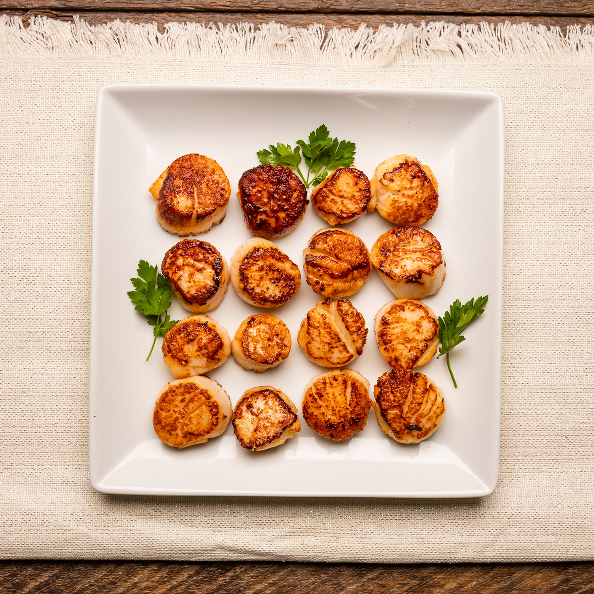 Plump and tender frozen New England scallops, ideal for gourmet seafood dishes.